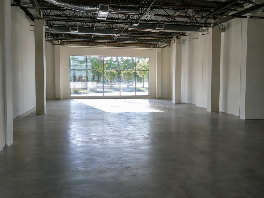 Empty commercial space with light through the storefront